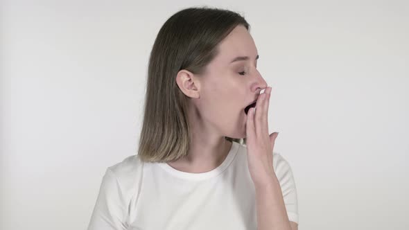 Young Woman Yawning and Stretching Body on White Background