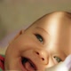 Portrait of a Happy Baby Lying in a Cradle and Smiling Closeup. - VideoHive Item for Sale