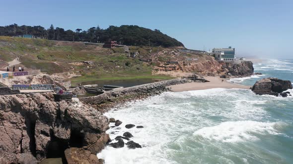 Close-up push-in aerial shot of the remains of the Sutro Baths at Land's End, San Francisco. 4K