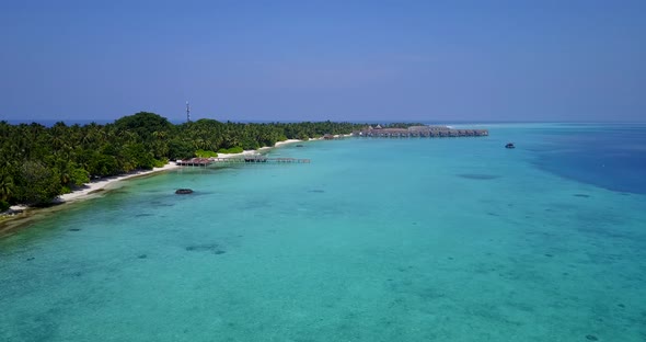 Beautiful birds eye abstract shot of a summer white paradise sand beach and blue water background in