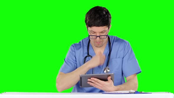 Doctor with Tablet Computer. Green Screen