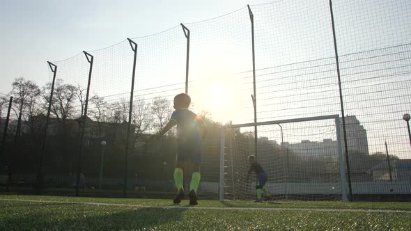 Skillful Young Football Player Scoring Goal