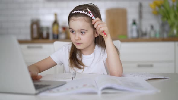 Girl Using Laptop During Online Studies