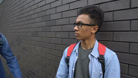 Impudent Teenager Taking Away Glasses From Insecure Black Boy, Mocking Bad Sight