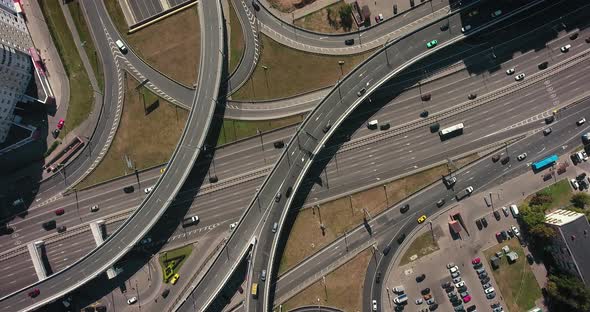 Aerial drone view of highway multi-level junction road with moving cars alt