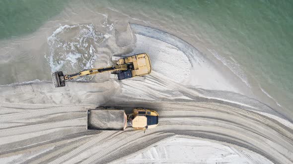 Unique view of large machinery working on a environmentally sensitive coastal rejuvenation project.