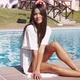Young Beautiful Smiling Woman Relaxing at Poolside - VideoHive Item for Sale