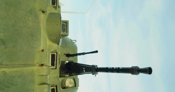 Coaxial Machine Gun on the Turret of an Armored Vehicle During a Military Conflict