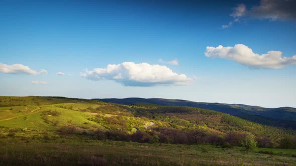 Valley with Meadows on Which Bushes and Trees Grow and the Balkan Mountains Under the Sky