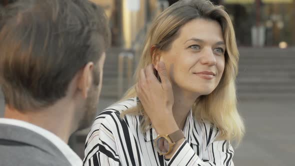 Lovely Mature Businesswoman Talking To a Colleague Outdoors