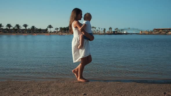 Adorable Cute Children Spending Time at Coastline in Sunset Time Together.