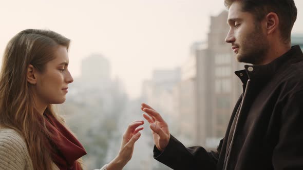 Hipster Couple Connecting Hands Outdoors. Beautiful Man and Woman Crossing Hands