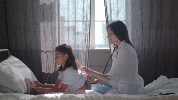 Patients and Doctors: Pediatrician Examines a Child