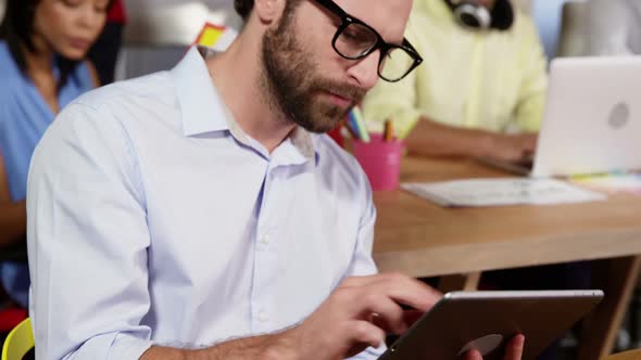 Male business executive using digital tablet