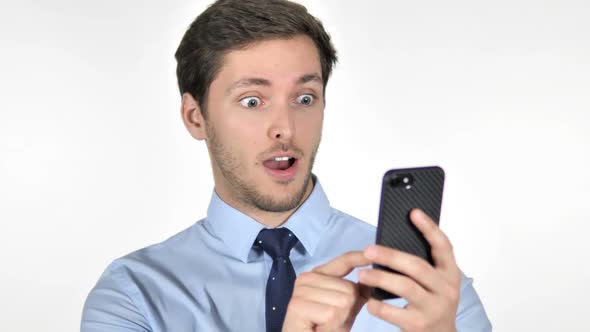 Wow Astonished Young Businessman Using Smartphone on White Background