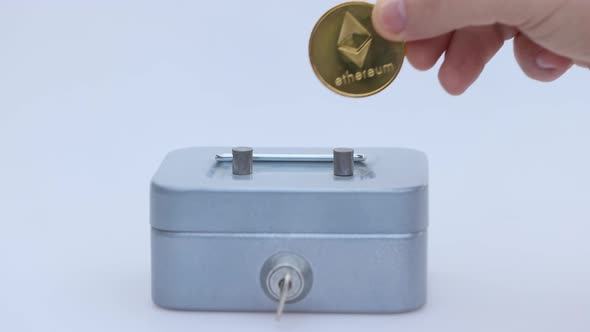 Little Saving Vault Hand Holds Golden Ethereum ETH Coin Virtual Money