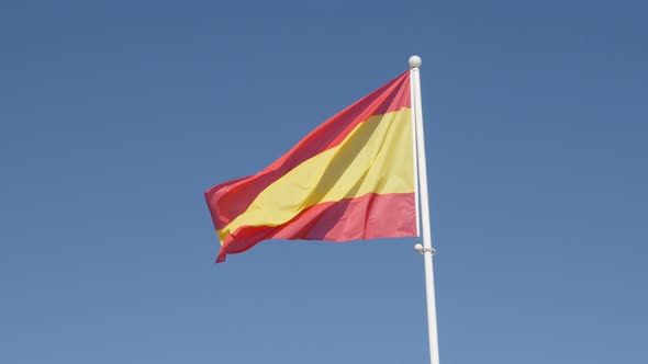 Famous Spanish red and yellow flag stripes on the wind 4K 2160p 30fps UltraHD footage - National sym