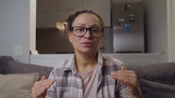 Adult Woman in Eyeglasses Holding Business Meeting Video Call at Home