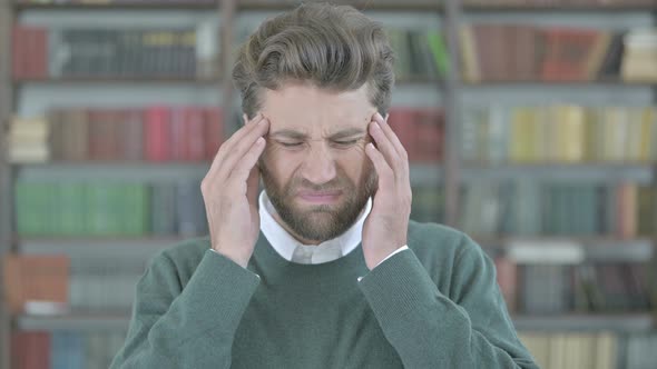 Stressed Young Man Having Headache