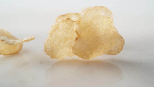 Potato chips falling. Slow Motion.
