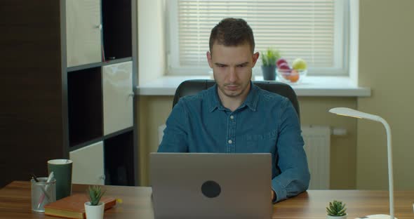 Man Freelancer Using Laptop Online Working From Home in Internet, Guy Typing on Computer Surfing Web