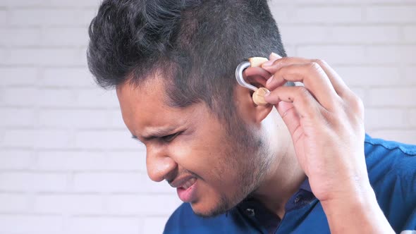 Hearing Aid Concept a Young Man with Hearing Problems