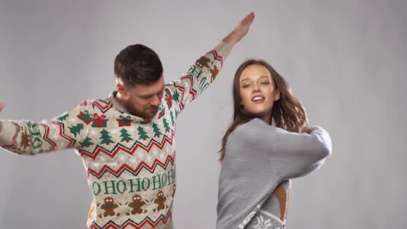 Happy Couple Dancing at Christmas Party