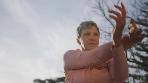 Senior woman outdoor yoga fitness