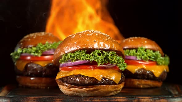 Super Slow Motion Shot of Hamburgers and Flames