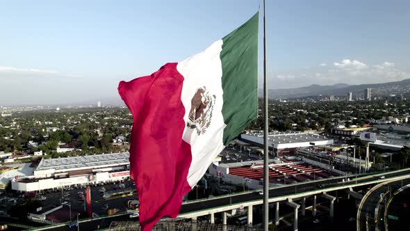 drone shot of mexico flag during windy day