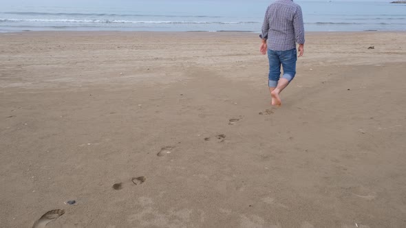 Footprints Man Walking on the Beach Footprints Can Be Seen