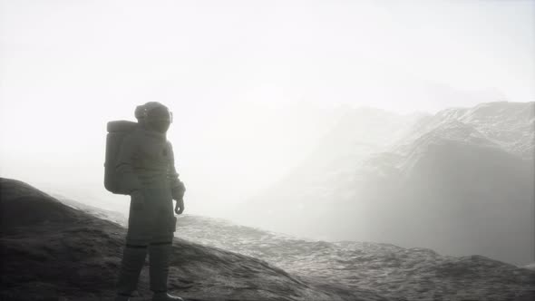 Astronaut on Another Planet with Dust and Fog alt