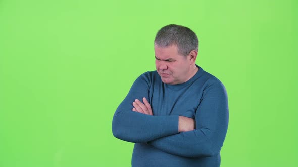 Headache Torments Middle Aged Man. Green Screen