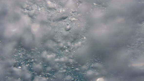 close-up view of air bubbles in the ocean water