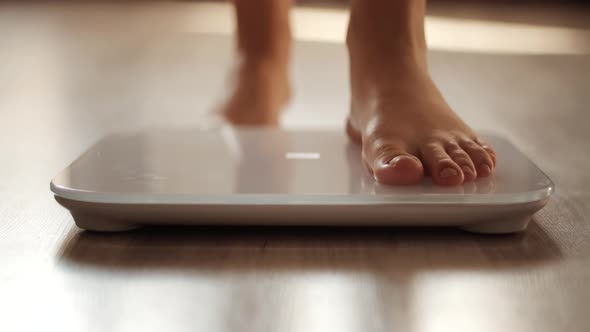 Woman On Scale.Scale On Floor.Girl Measuring Weight On Health Scale.Bathroom Scale.