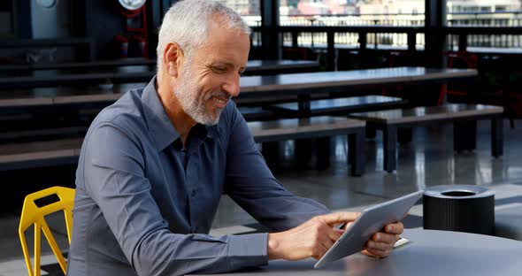 Businessman using digital tablet in hotel