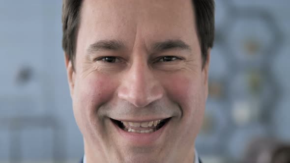 Close Up of Smiling Middle Aged Man Face
