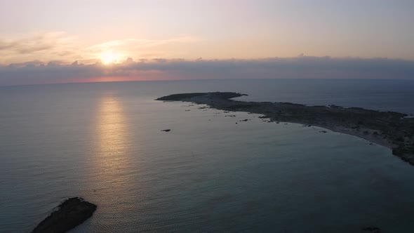 Flyover Ocean at Sunset. Beautiful Aerial Relax Landscape. Flying from above island 