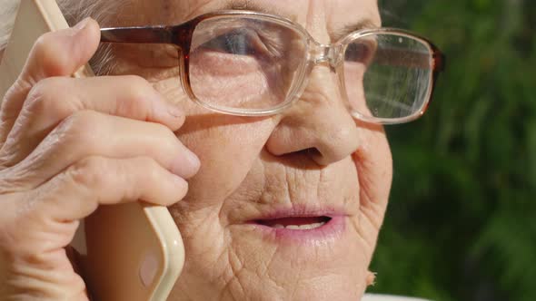 Senior Woman Speaking on Mobile Phone