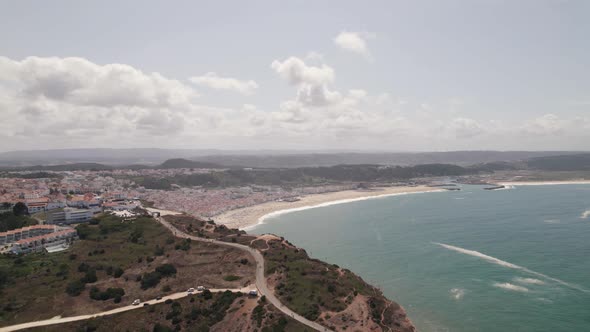 Panoramic view of Nazare beach and Atlantic ocean coast, Portugal. Charming beach resort town