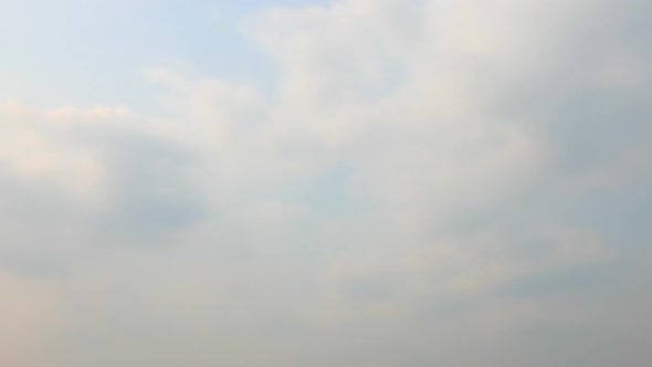 Time lapse of white cloud moving pass around sky background