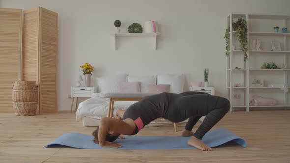 African American Woman Practicing Yoga Upward Bow