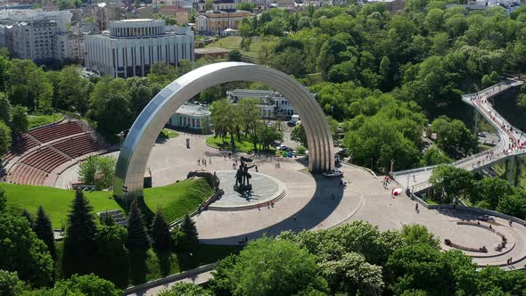 Summer flight in Kiev over the People's Friendship Arch, a pedestrian bridge.