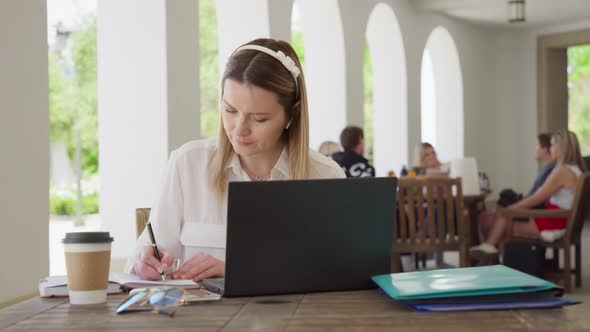 Beautiful Young Businesswoman Wearing White Shirt Using Laptop Sitting Outside