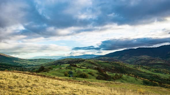 Time Lapse of Blue Sky with Clouds Over Mountain