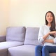 Asian woman sit on sofa and relax - VideoHive Item for Sale