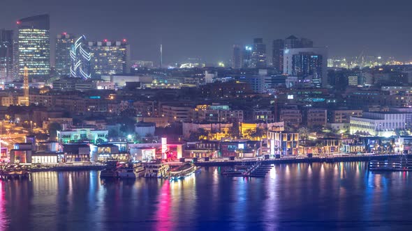 Dubai Creek Landscape Night Timelapse with Boats and Ship Near Waterfront