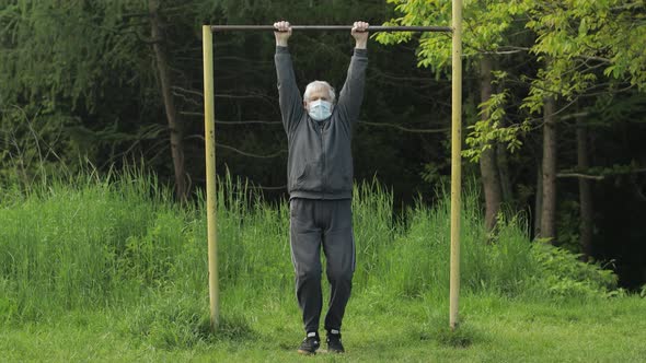 Active Senior Old Man Do Stretching Physical Exercises in Coronavirus Quarantine