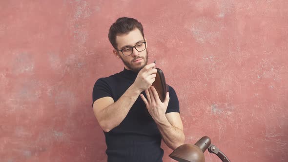 Young Man Checking the Glued Sole