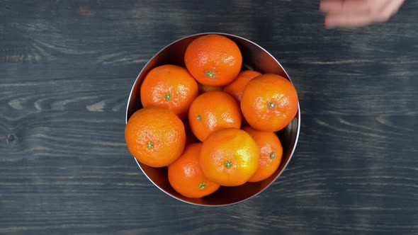 Top View Man's Hands Are Placed a Metal Bowl with Ripe Tangerines a Source of Vitamin c